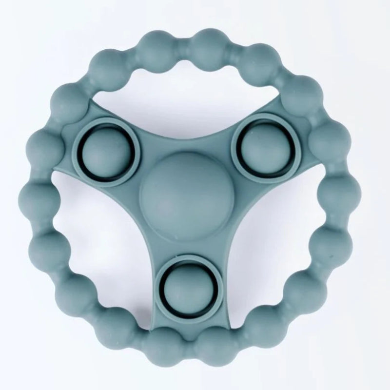 Siliconen bijtring met pop-it functie in aardetint van Rammelaartje