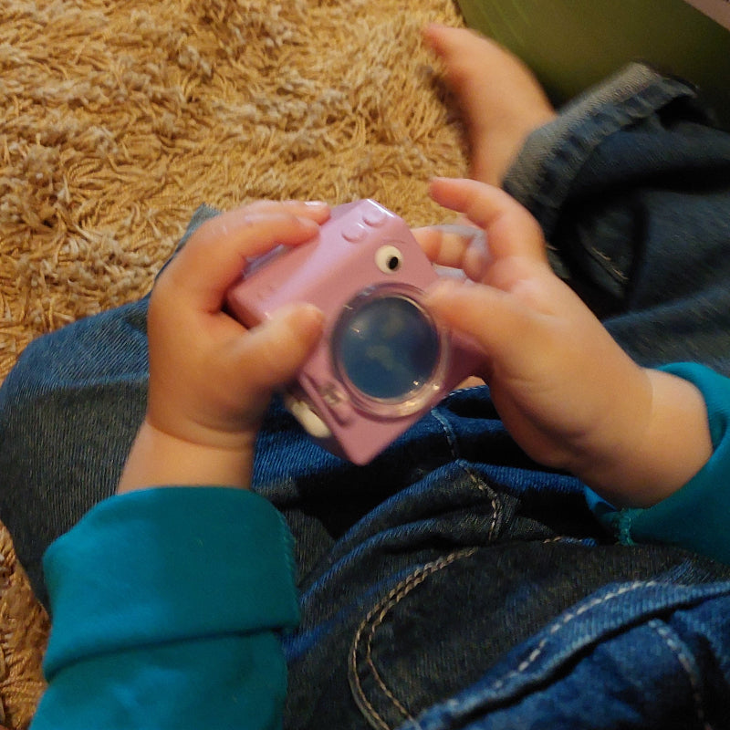fidget wasmachine in kinderhand, friemelspeelgoed