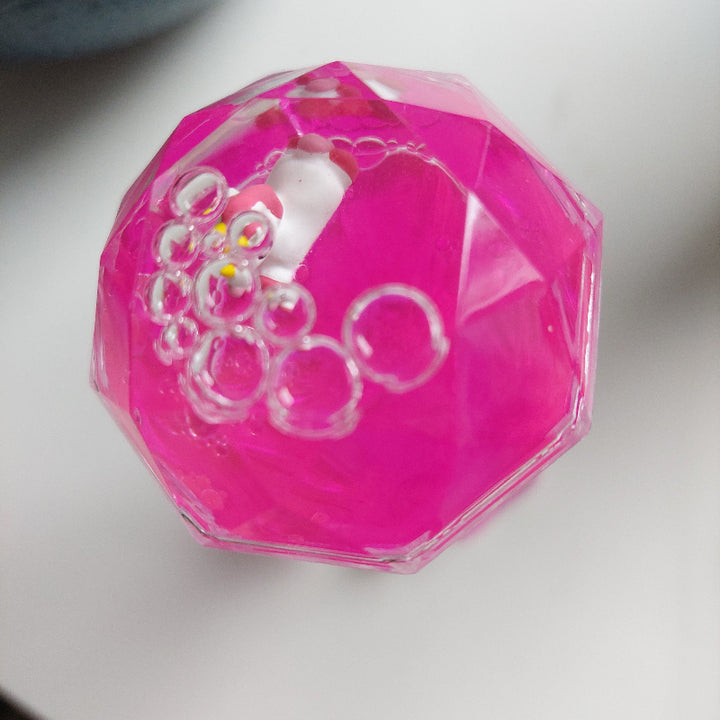 olie zandloper roze met eenhoorn, boven aanzicht , sensoriekmateriaal