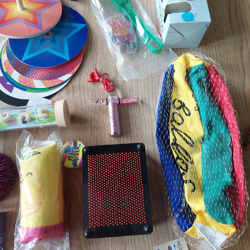 pinpreesion, luchtballon hoes, caleidoscoop, flutschi waterslang, motoriek materiaal voor de basisschool