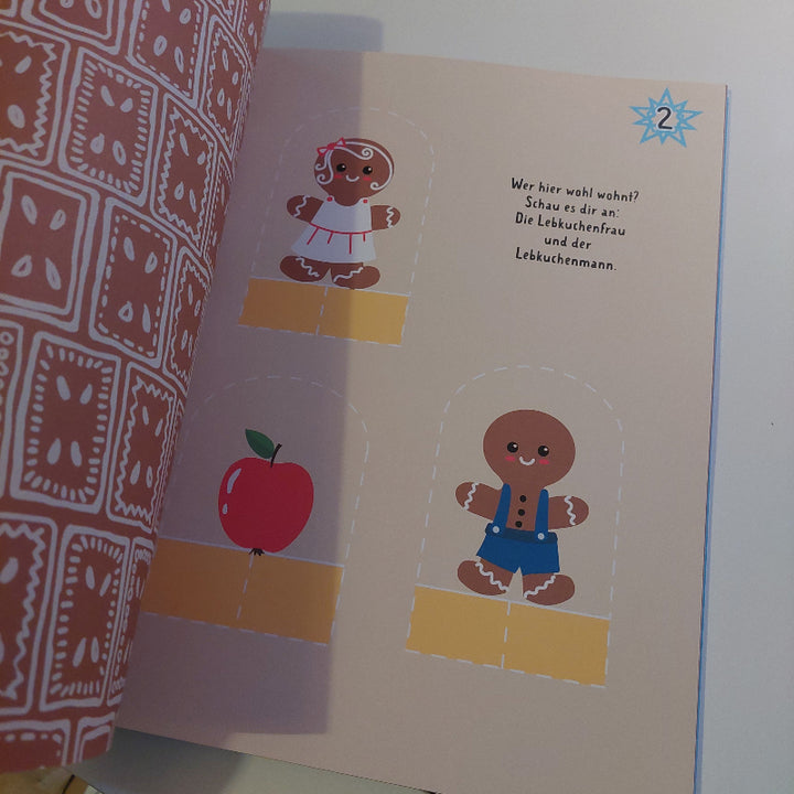 knutselpagina van het pepperkoek huis adventskalender knutselboek, motoriek speelgoed, fijne motoriek oefening