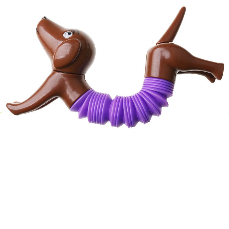 pop tube hond, fidget dog, bruine hond met paarse pop tube gebogen, fijne motoriek fidget, tweehandig speelgoed