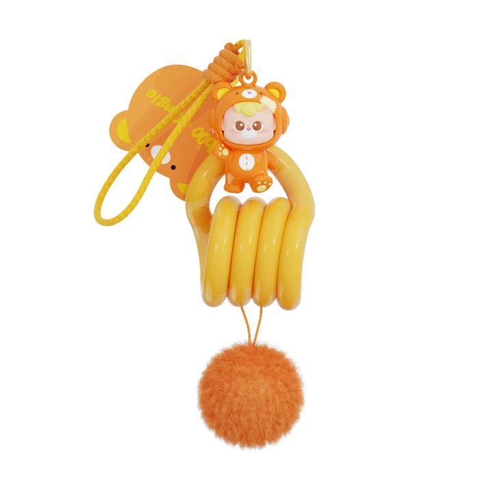 Oranje DiuDiu Baby Bear collectible met Tangle keychain detail uit de populaire Tangle blind box serie.