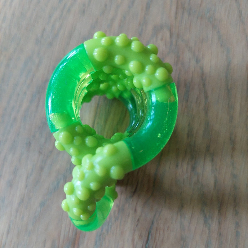 Tangle crush slime groen, structuur tangle op tafel