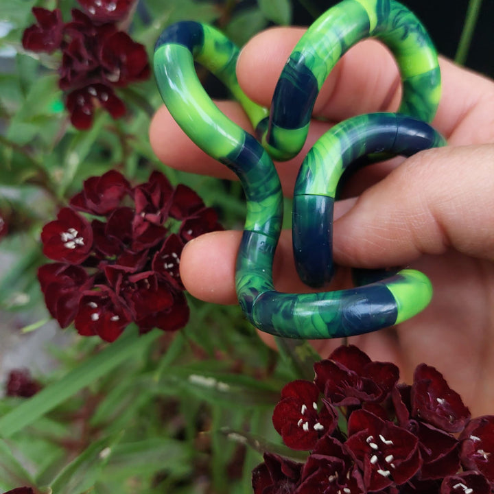 nieuwe tangle marble groen blauw in hand met bloemen, friemelspeelgoed, fidget toys