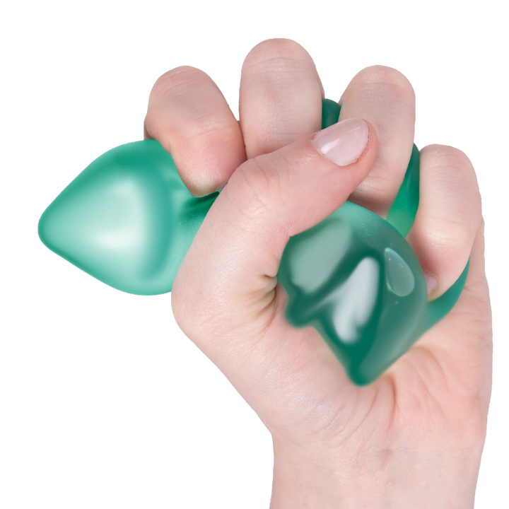 hand knijpt anitstressbal tree van speks, christmas tree van speks