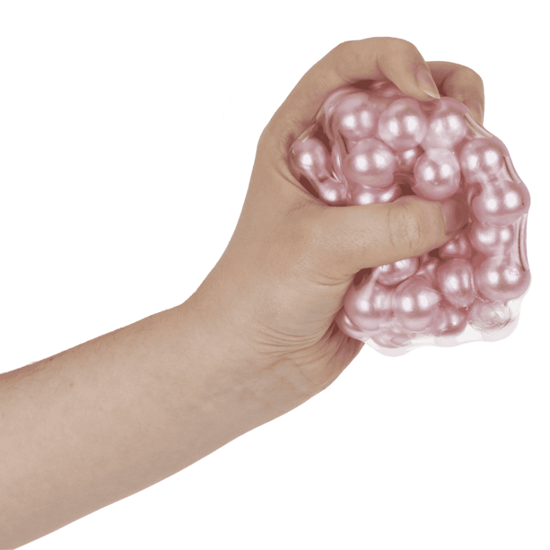 hand drukt roze asmr bal, sensoriek squeeze bal