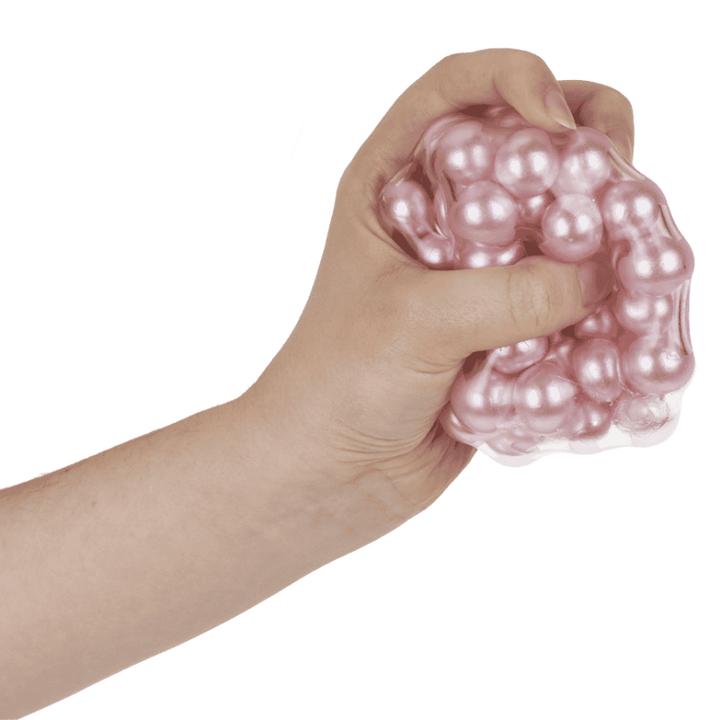 hand drukt roze asmr bal, sensoriek squeeze bal